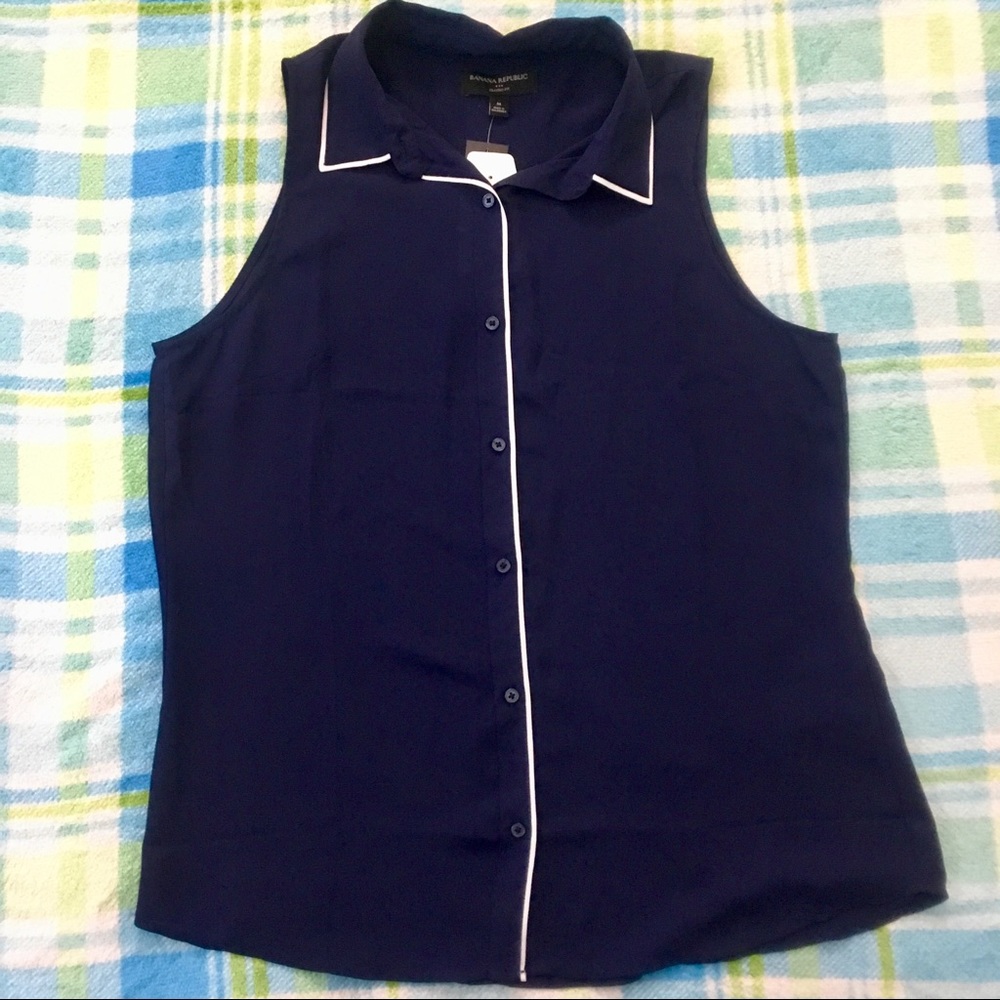 Navy Blue with white trimming, sleeveless shirt.